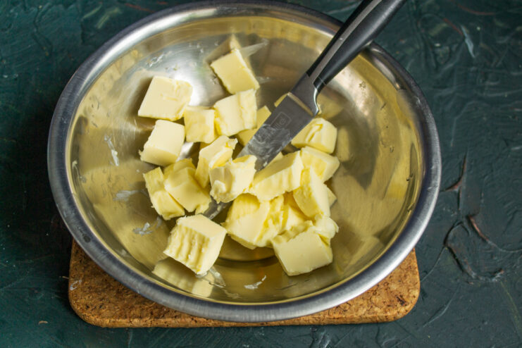 Dicing butter for dough Small cubes of butter placed in a mixing bowl for shortcrust pastry