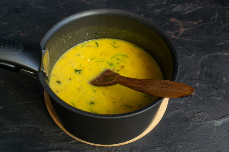 Simmering the Soup Corn soup simmering in a pot with broth