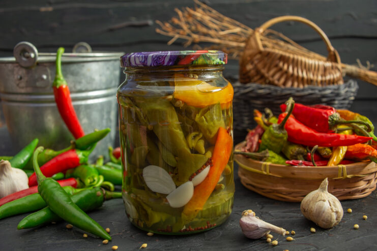 Finished jar of marinated chili peppers with citric acid ready to be served