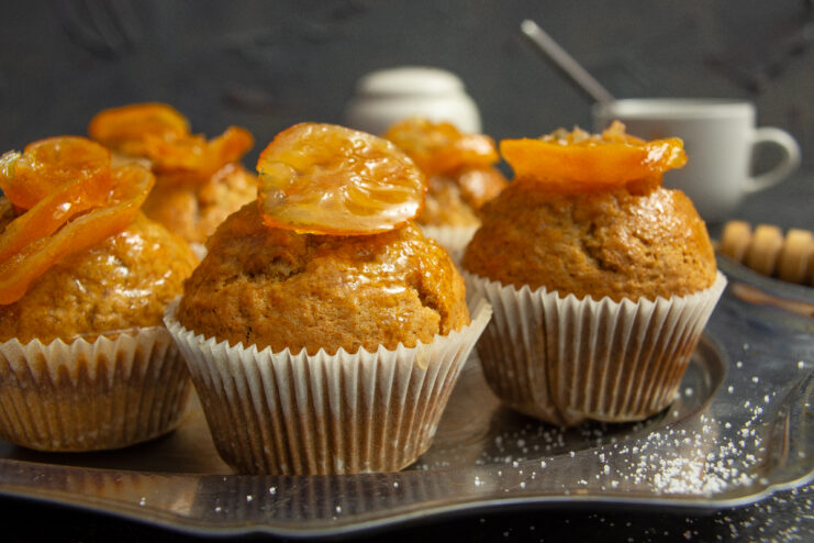 Freshly baked honey muffins with orange marmalade filling and fresh citrus slices