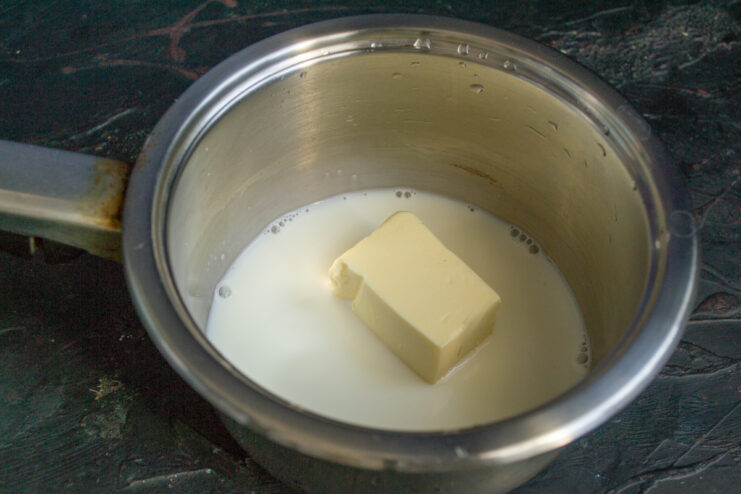 Preparing the Liquid Base Milk, butter, and salt melting in a saucepan on the stove