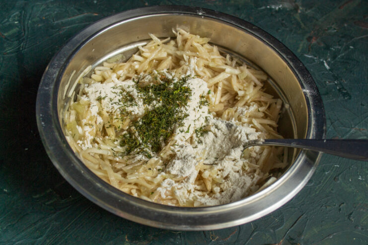 Spices and flour for the batter Flour and dried dill sprinkled over grated vegetables