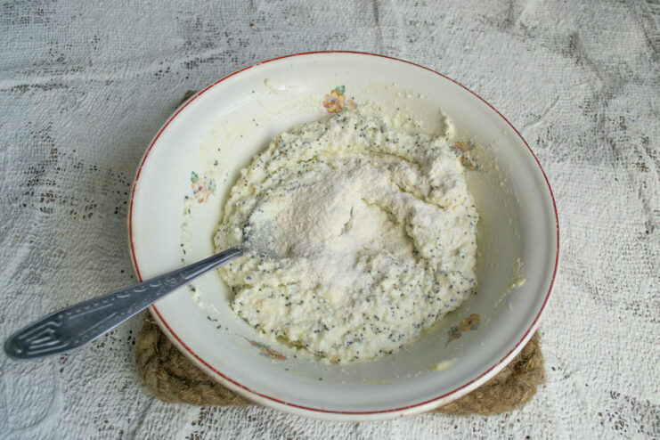Adding wheat flour Adding wheat flour to the bowl of dumpling dough