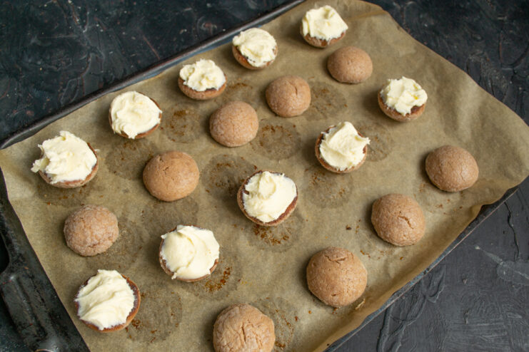 Piping Mascarpone Filling Adding mascarpone cream filling to the flat sides of the cookies