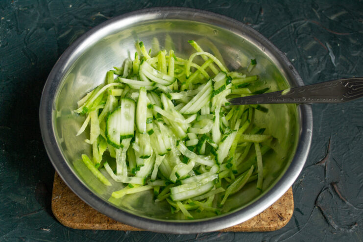 Freshly julienned cucumber and radish mixed in a bowl