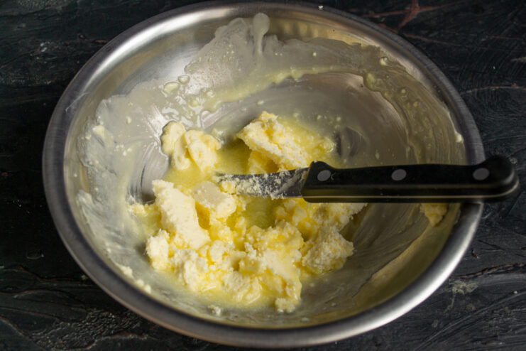 Softening the butter Diced butter in a mixing bowl for cookie dough.