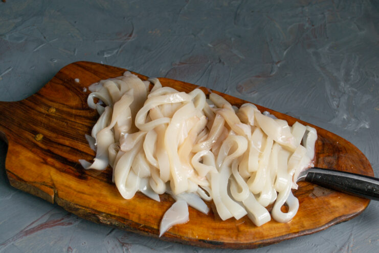 Slicing the Seafood Squid sliced into thin rings