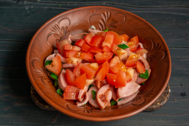 Tomato Layer Diced tomatoes layered over sautéed sausages