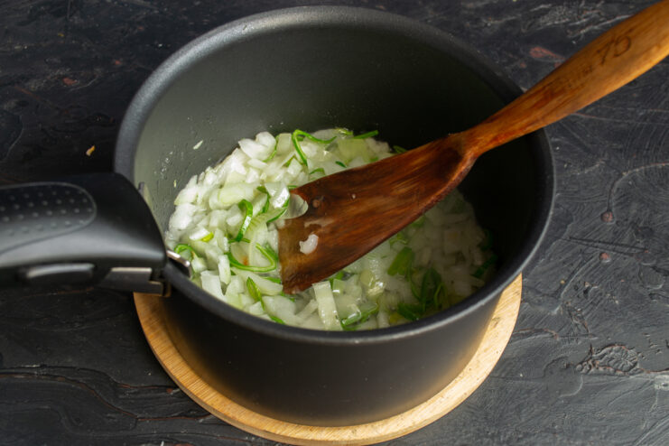 Sautéing the Soup Vegetables Chopped onion, leek, and celery sautéing in a pot