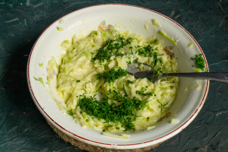 Adding Fresh Herbs Mixing finely chopped fresh dill into the fritter batter