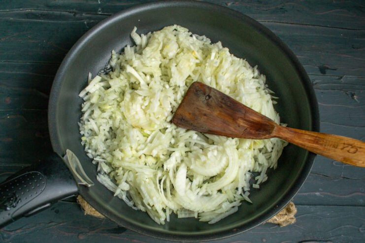 Sautéing the onion Sautéing chopped onions in a skillet