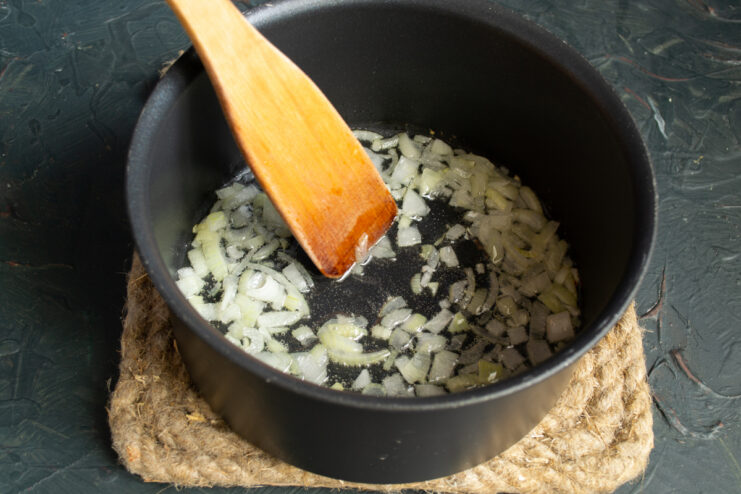 Sauteing onions for the soup Finely chopped onions sauteing in a heavy-bottomed pot.