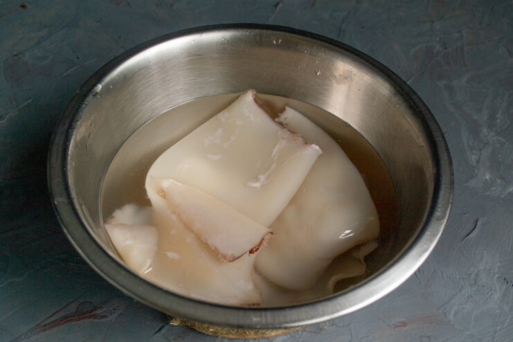 Cleaning the Squid Cleaned squid tubes ready for slicing