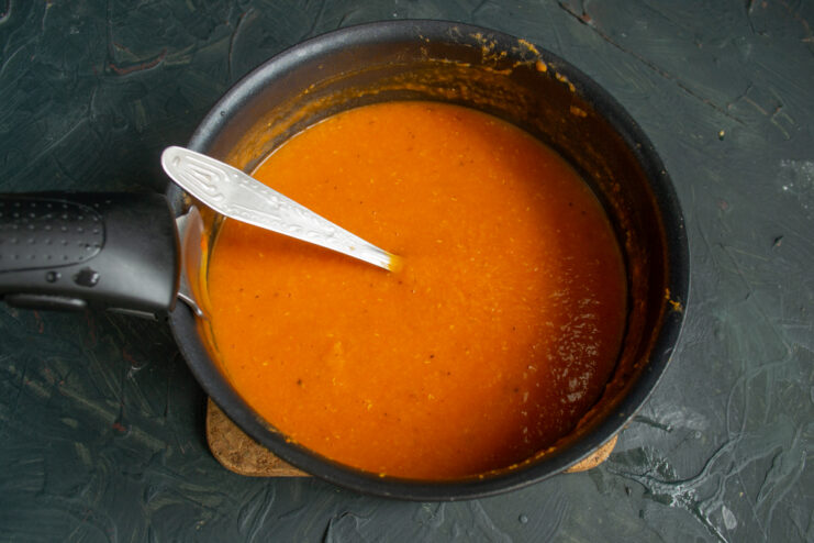The Finished Creamy Soup Smooth, velvety pureed lentil soup heating up in a pot.
