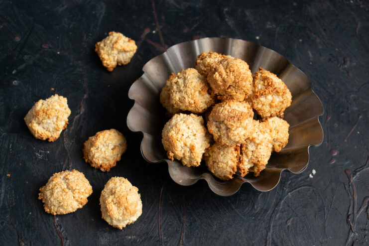 Freshly baked flourless almond cookies in a decorative bowl