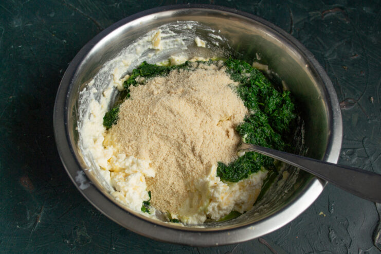 Adding breadcrumbs for stability Adding breadcrumbs to the spinach and cheese filling