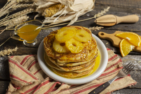 Whole Wheat and Cornmeal Pancakes with Orange Syrup and Pineapple