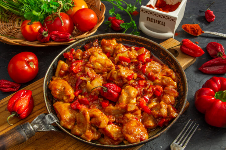 Creamy chicken paprikash simmering in a skillet