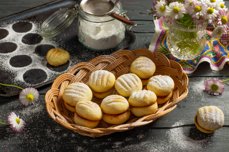 Margarine shortbread cookies filled with jam and dusted with powdered sugar