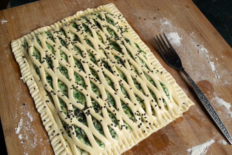 Sprinkling with sesame seeds Puff pastry tart sprinkled with black and white sesame seeds