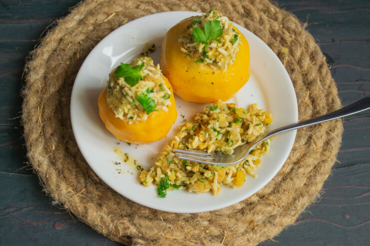 Garnishing stuffed turnips with herbs and olive oil