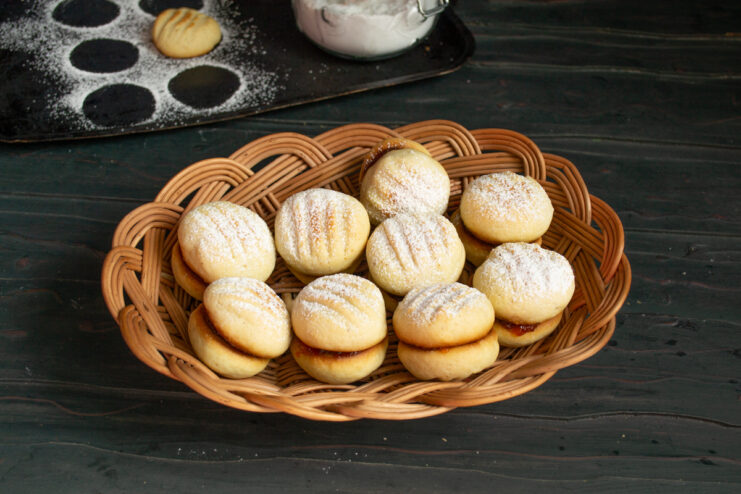 Serving cookies with tea Serving baked jam cookies in a basket
