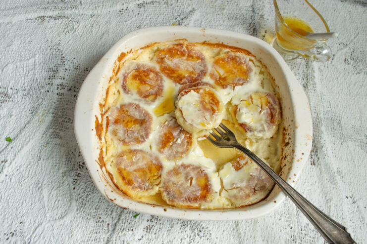 Serving With Honey Serving hot baked syrniki drizzled with honey