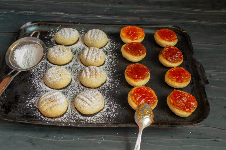 Dusting with powdered sugar Dusting cookies with powdered sugar through a fine sieve