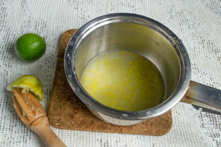 Cooking the lime syrup Cooking lime syrup with zest in a small saucepan