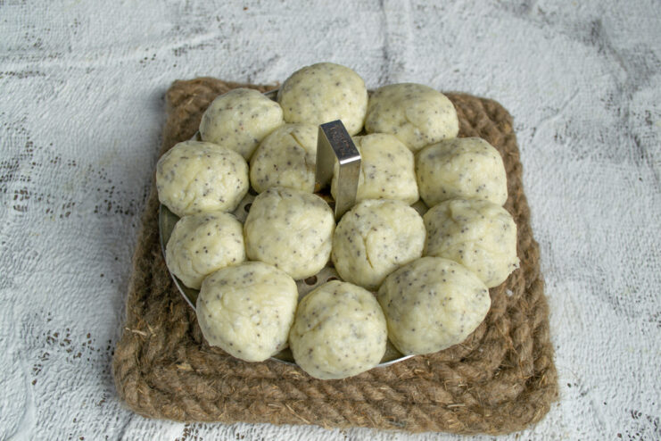Freshly steamed dumplings Puffed and cooked dumplings on a steamer rack