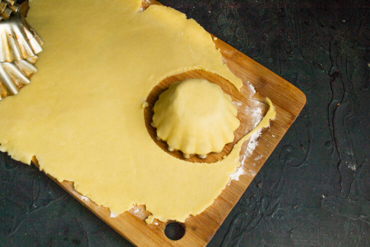 Shaping the Tartlet Bases Cutting pastry dough circles using a metal cutter