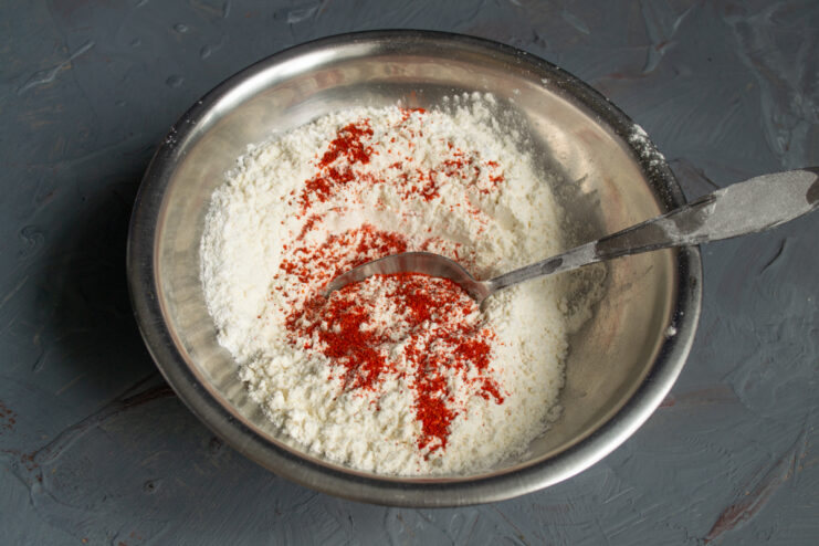 Dry ingredients with paprika Wheat flour mixed with ground paprika in a bowl