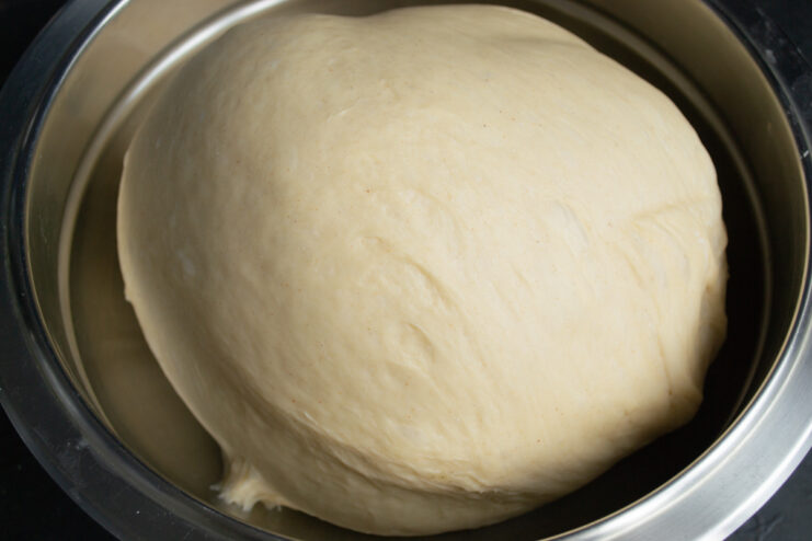Proofing the dough Fluffy proofed yeast dough doubled in size inside a bowl