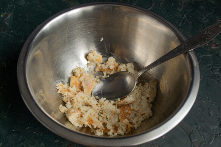 Stale bread soaking in milk inside a bowl