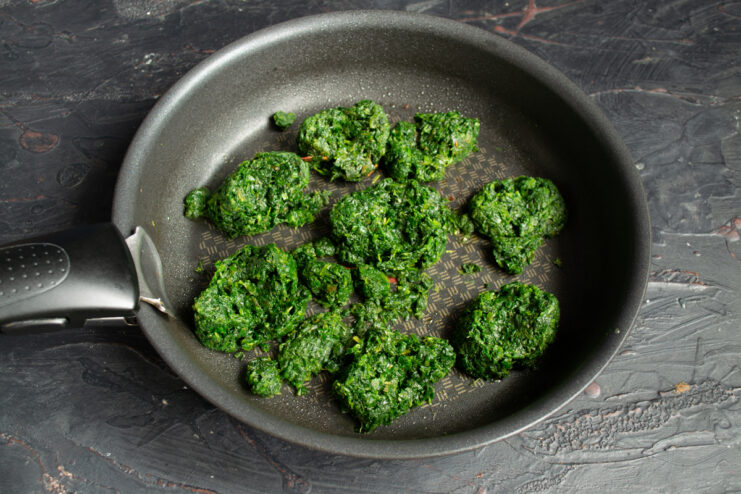 Thawing frozen spinach in a hot skillet