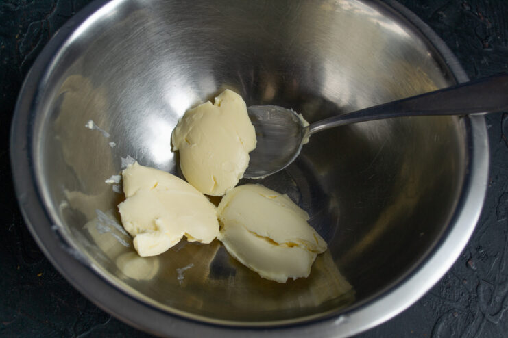 Softening the Butter Softened butter in a metal mixing bowl ready for the dough