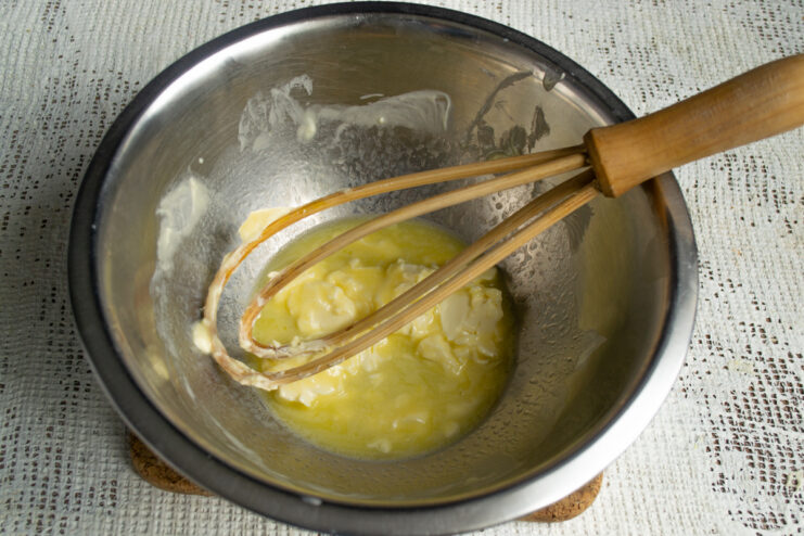 Softening the butter Softened butter in a mixing bowl with a whisk