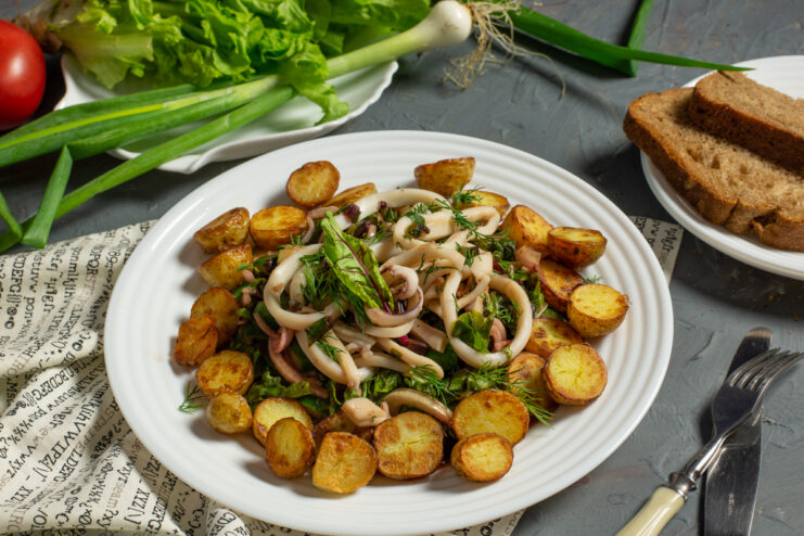 Finished beet greens and squid salad with fried potatoes