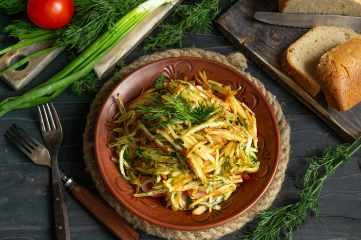 Anthill salad with crispy fried potatoes, tomatoes, and cucumbers