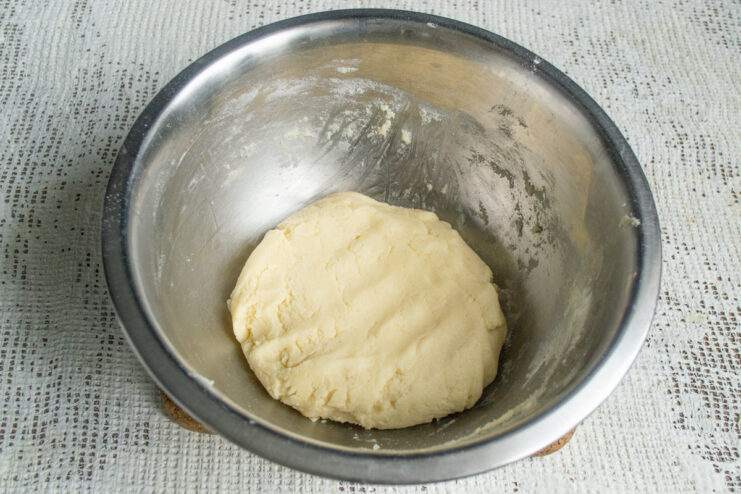 Chilling the dough A ball of shortbread dough resting in a metal bowl