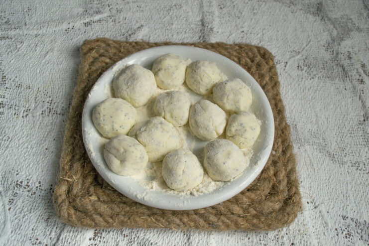 Shaping the dumplings Rolling cheese dough into small round balls