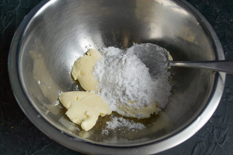 Mixing Butter and Sugar Butter mixed with powdered sugar and a pinch of salt