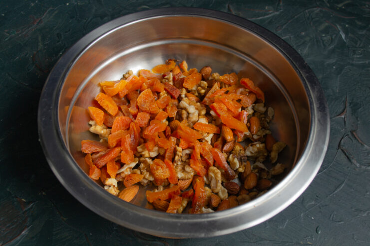 Adding dried fruit A mix of toasted nuts and chopped dried fruit in a bowl