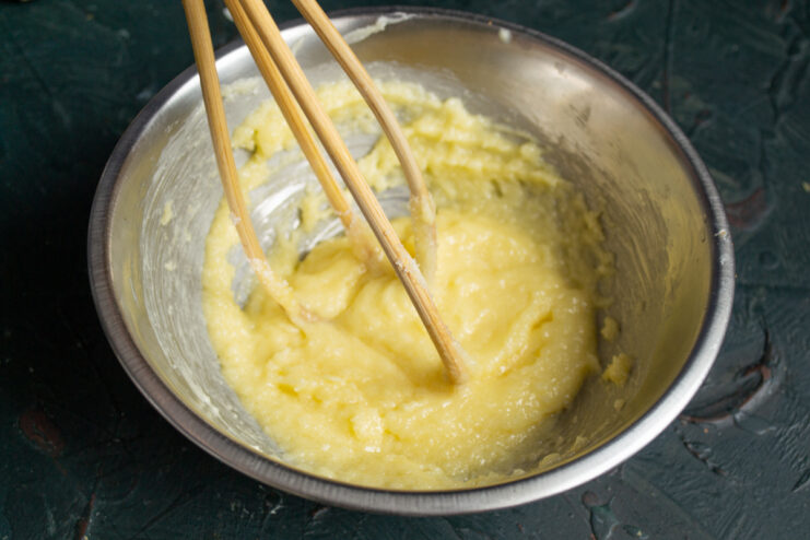 Mixing Sugar And Honey Whisking butter, honey, and fine white sugar together in a bowl