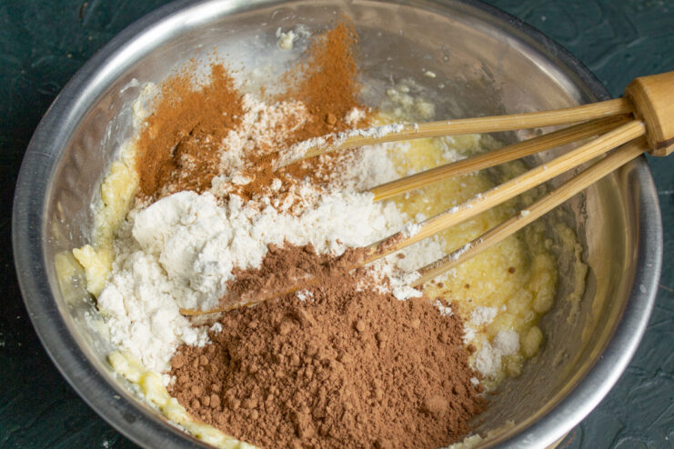 Preparing the Chocolate Dough Mixing flour, cocoa powder, and cinnamon in a bowl for chocolate shortcrust pastry dough