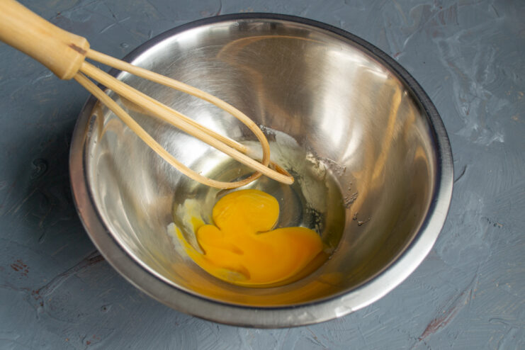 Preparing the egg mixture Whisking an egg and sea salt together in a small bowl