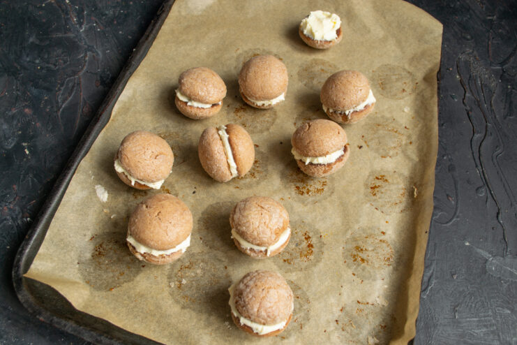 Sandwiching the Cookies Sandwiching two chocolate cookie halves with mascarpone cream