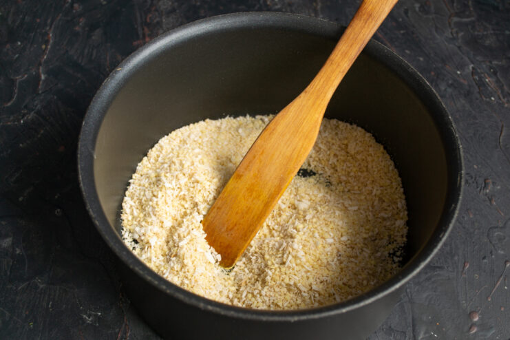 Dry almond mixture inside a heavy-bottomed saucepan