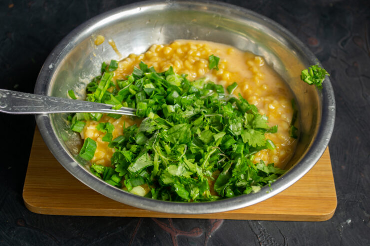 Mixing in fresh herbs Freshly chopped cilantro and parsley added to the pie filling.