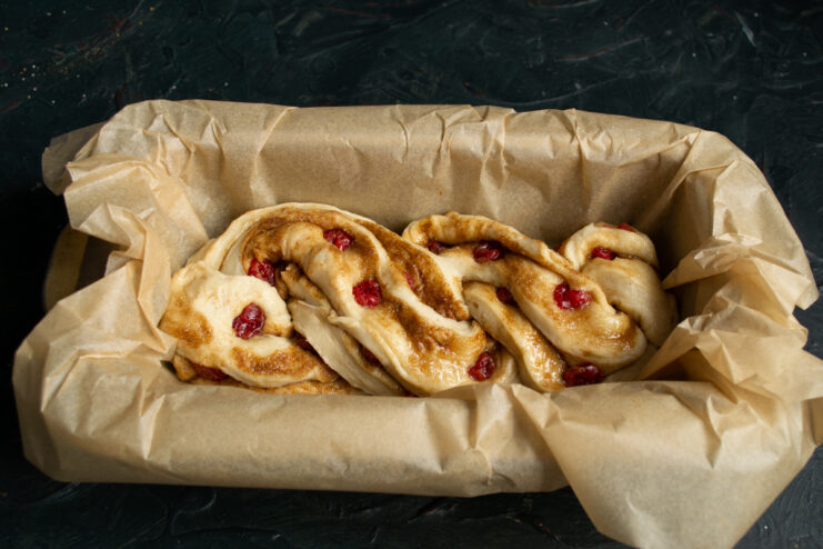 Final proof in the pan Raw braided babka dough resting inside a rectangular baking pan